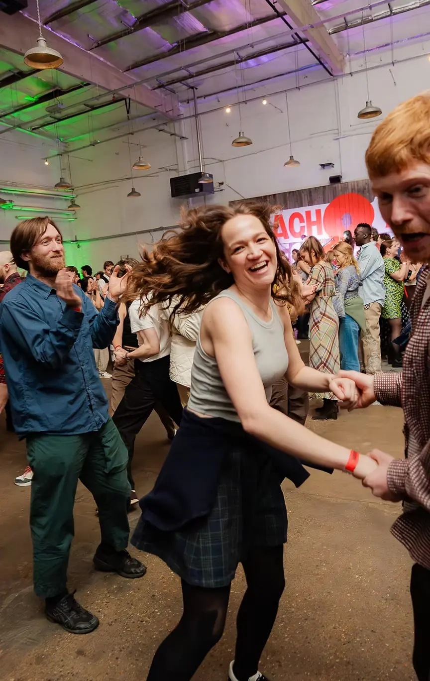 Dancers spinning at a public ceilidh